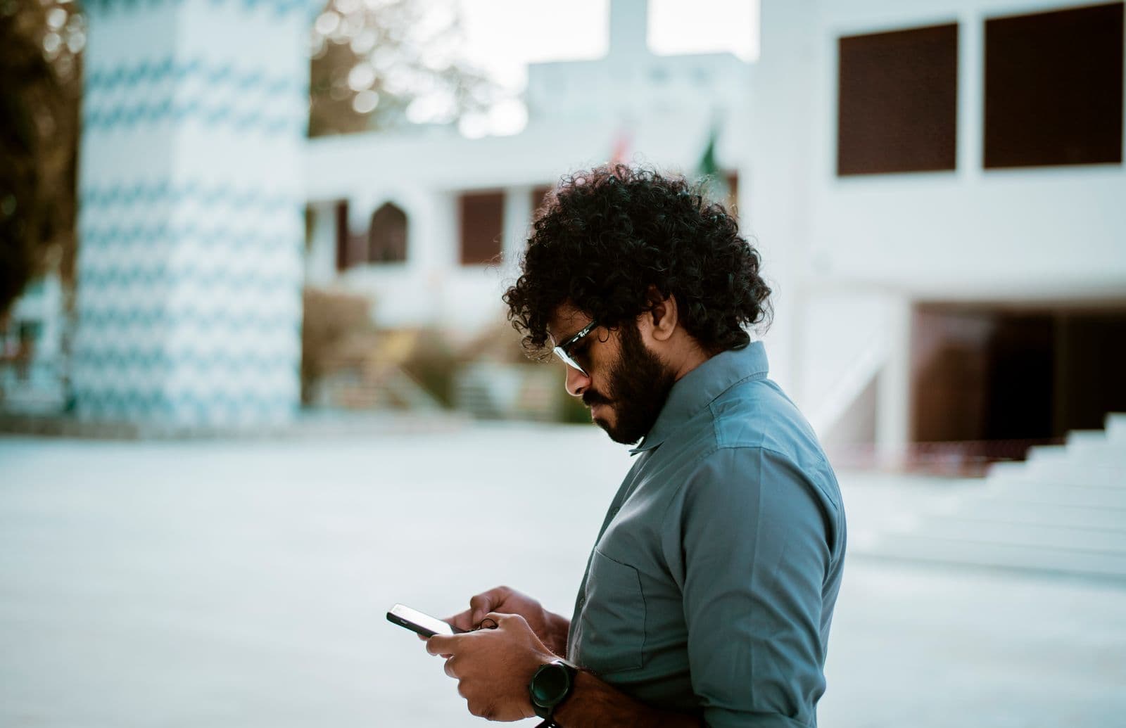 Business owner checking a payment on his phone