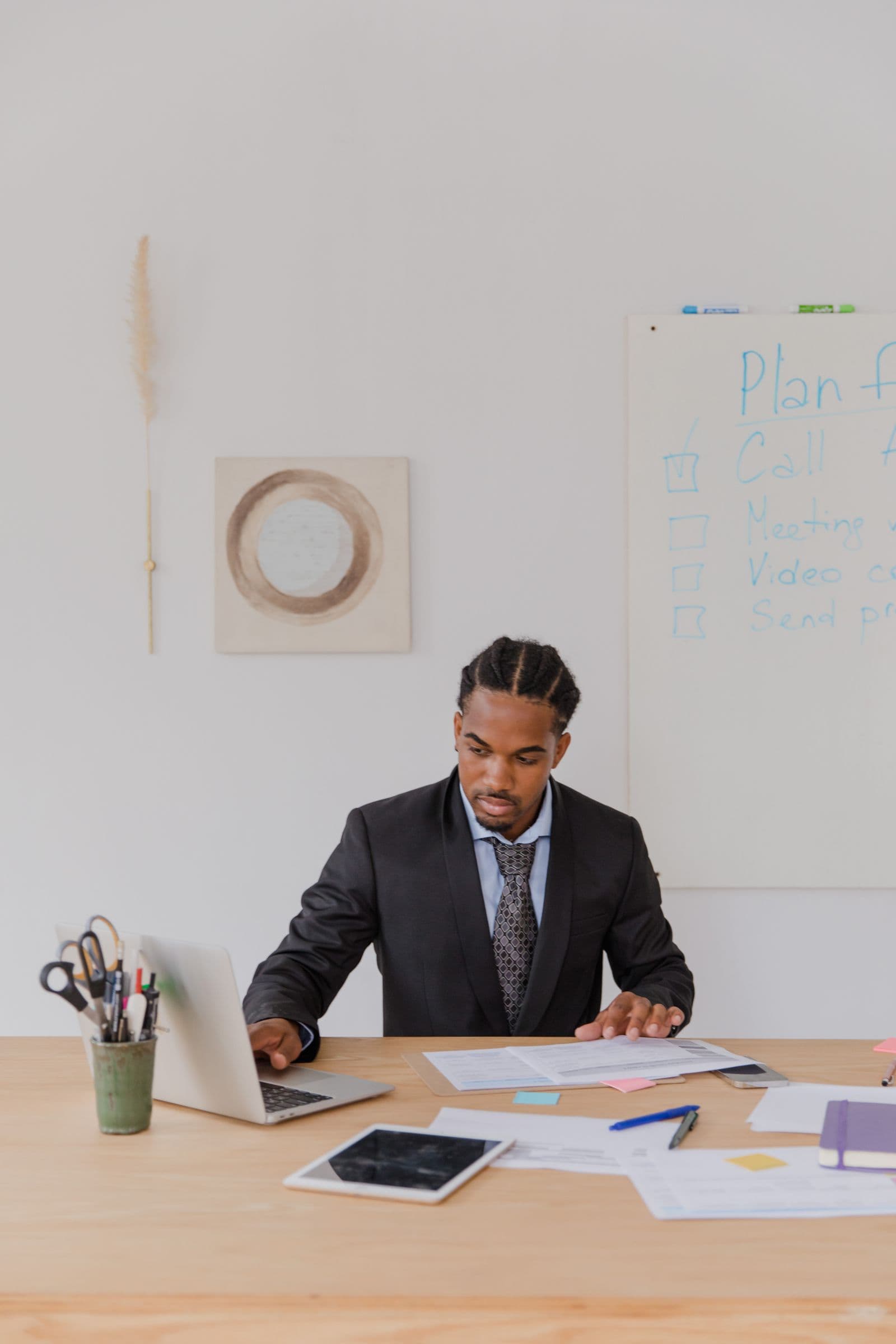 Business owner working through records at a desk