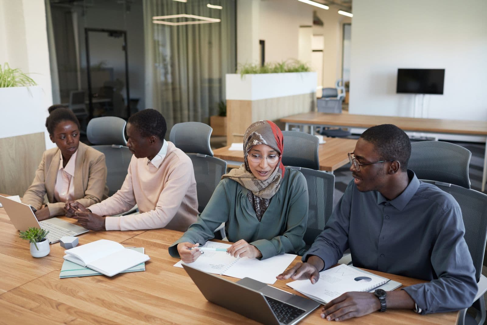 Head office team reviewing branch performance figures together